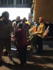 Man in uniform with a huge bag.