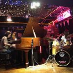 jazz combo: piano, drums, bass