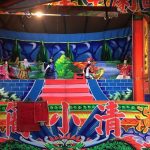 Puppets on a stage.