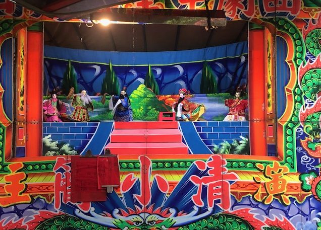 Puppets on a stage.