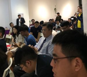 People listening to a speaker.