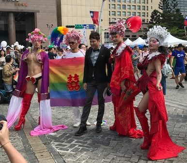 Group of cosplayers posing for photos.