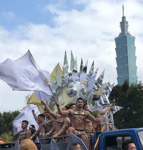 A truck full of men in costumes.