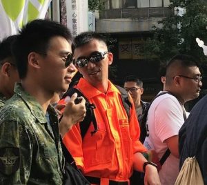 Marchers in army and coast guard uniforms.