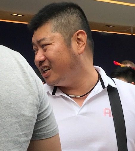 A man, head and shoulders.