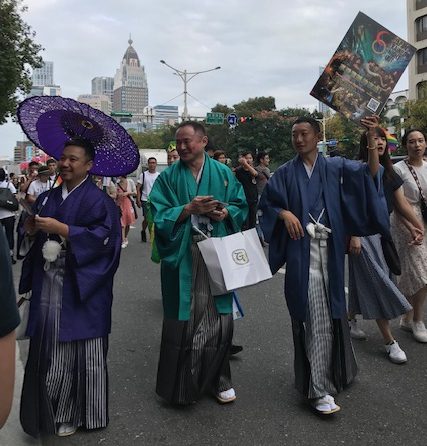 Three men in traditional Japanese clothing.