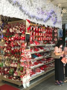A wall of Christmas decorations at a store.
