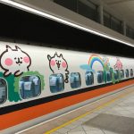 A train decorated with cartoon animals.