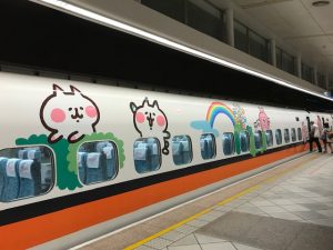 A train decorated with cartoon animals.