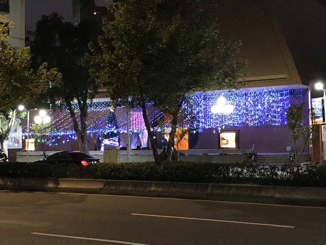 Church facade with many blue lights.
