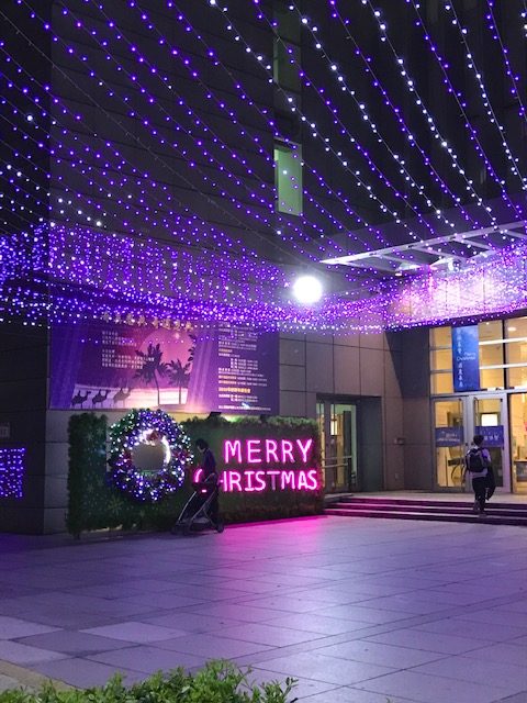 Church front with lights spelling out "Merry Christmas"