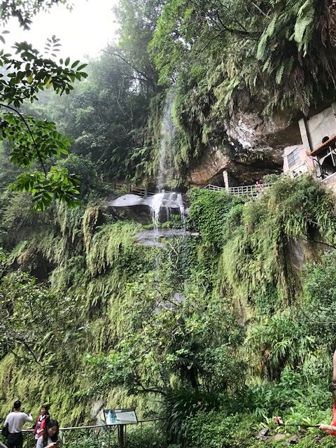 A cave and waterfall.