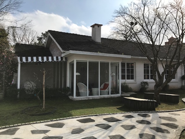 House with glassed-in porch.