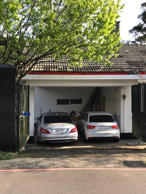 Two cars in a garage