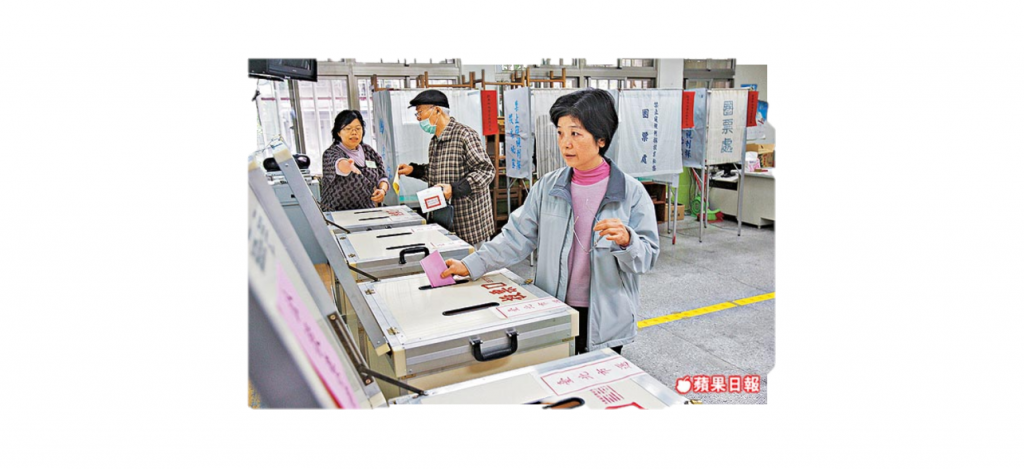 A woman placing a ballot in a box.