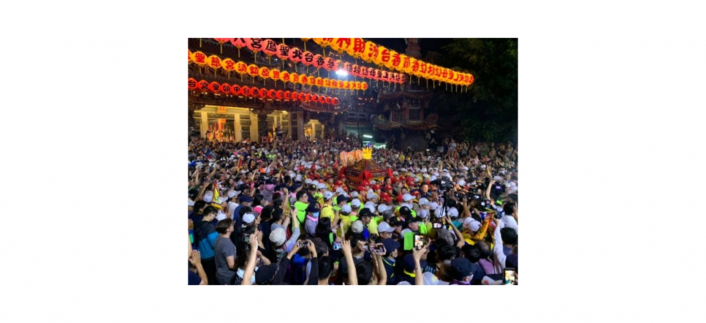 Huge crowd outside a temple.